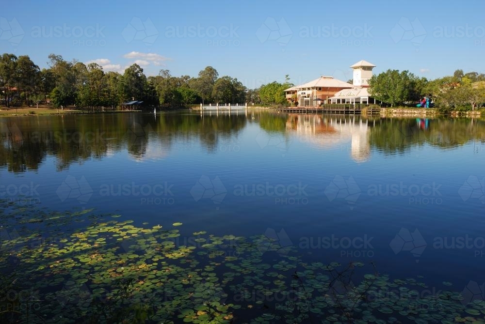 Suburb with shops and cafes by the lake. - Australian Stock Image