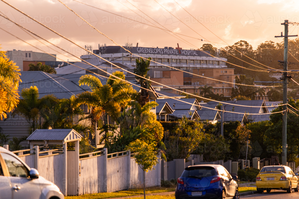 suburban Greenslopes with the hospital on the hill overlooking the suburb - Australian Stock Image