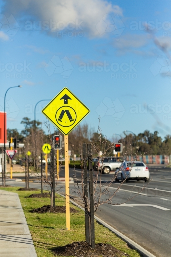 Suburban roadside with pedestrian crossing sign - Australian Stock Image