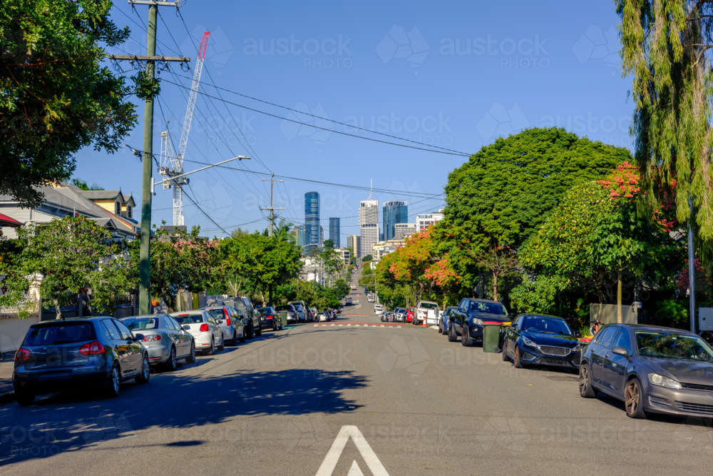 Suburban Street with Keep Left Sign and Brisbane CBD in the Background - Australian Stock Image