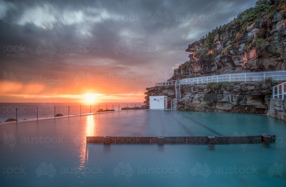 Summer sunrise over Bronte rock pool, Sydney - Australian Stock Image