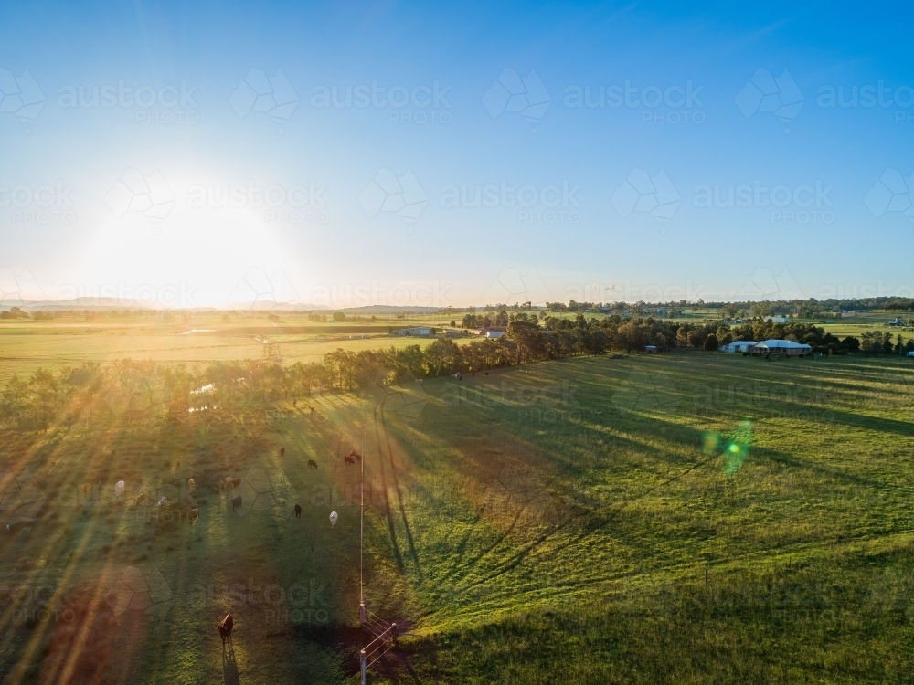 Image of Sun setting in blue sky over rural Australian agricultural ...