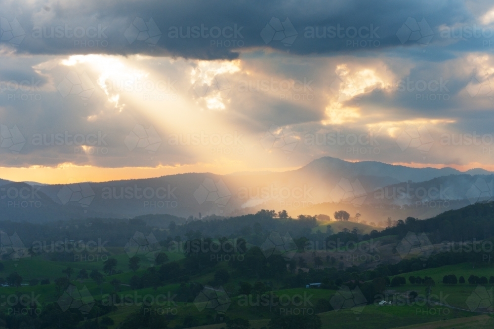 Image of Sunbeam over farming land Austockphoto