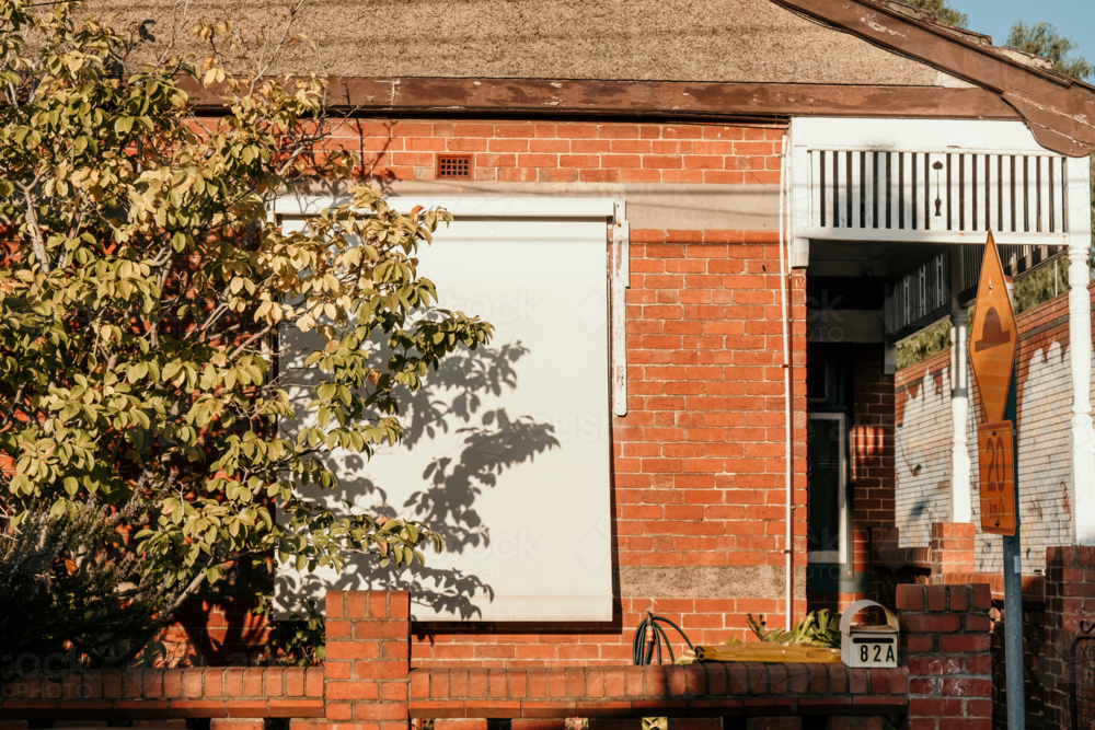 Sunlight  and shadows on a suburban house front. - Australian Stock Image