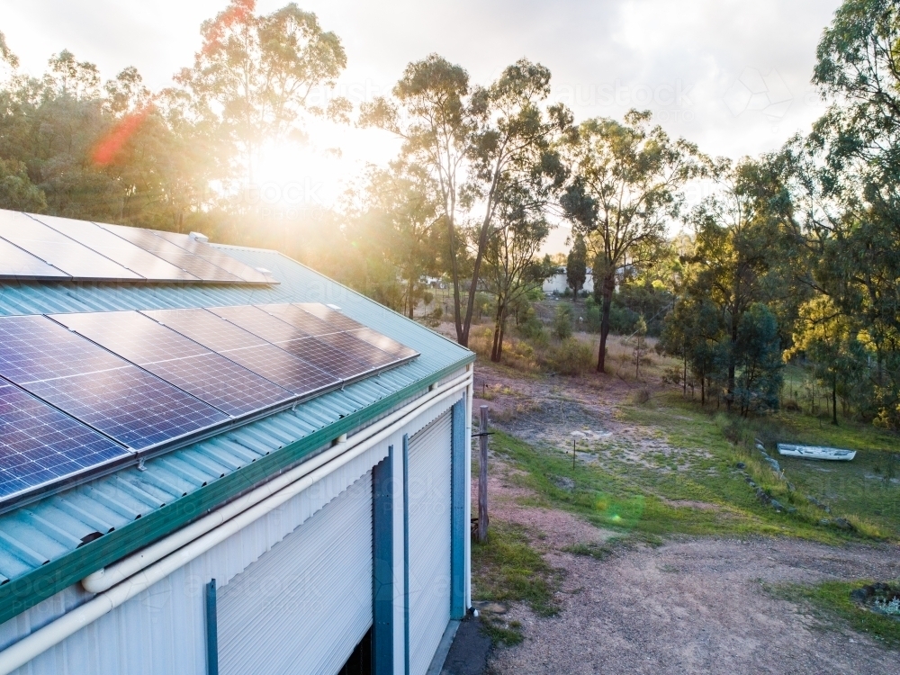 Sunlight over solar panels installed on roof of country home in NSW Australia - Australian Stock Image