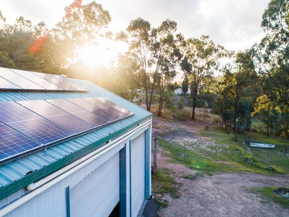 Sunlight over solar panels installed on roof of country home in NSW Australia - Australian Stock Image