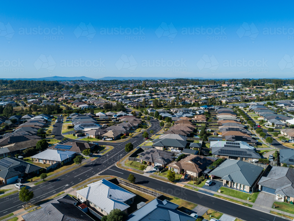 Sunlit aerial view over houses in Aberglasslyn a Maitland suburb in Hunter Valley : Austockphoto Sunlit aerial view over houses in Aberglasslyn a Maitland suburb in Hunter Valley - Australian Stock Image