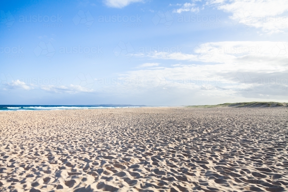Sunlit empty beach - Australian Stock Image