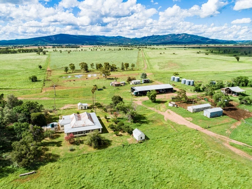 Sunlit farm homestead and sheds - Australian Stock Image