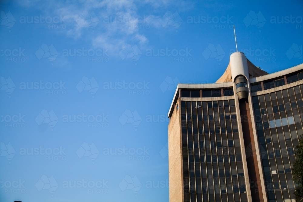 Sunlit high rise building in Chatswood Sydney with blue sky - Australian Stock Image
