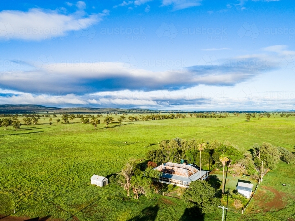 Sunlit homestead on farm - Australian Stock Image