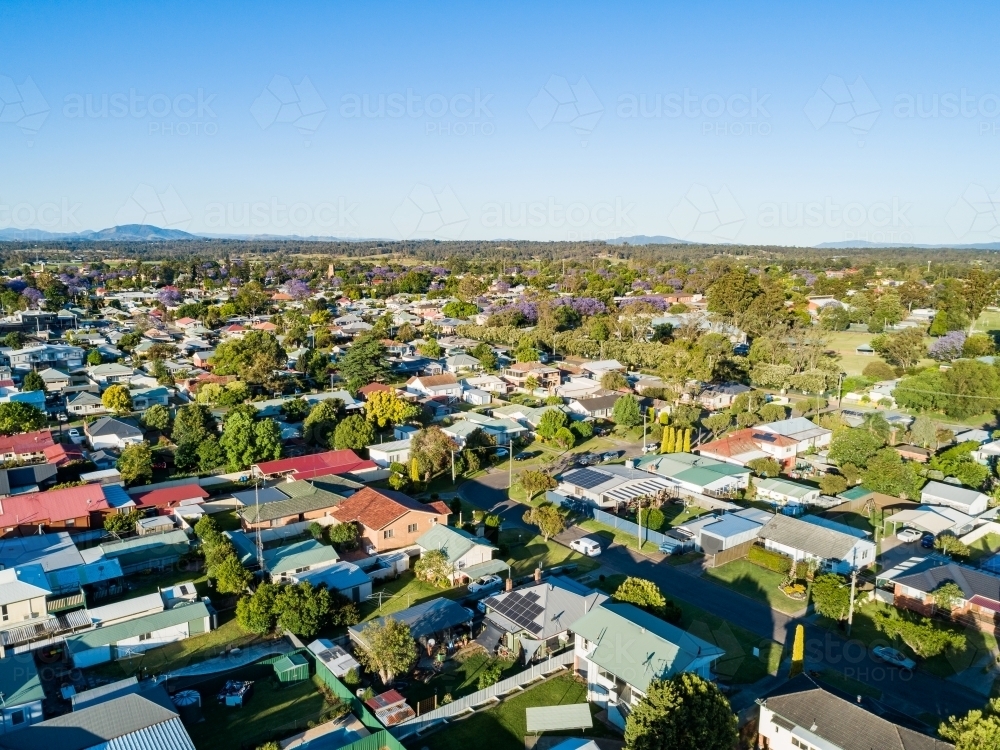 Sunlit quiet suburban street in country town - Australian Stock Image
