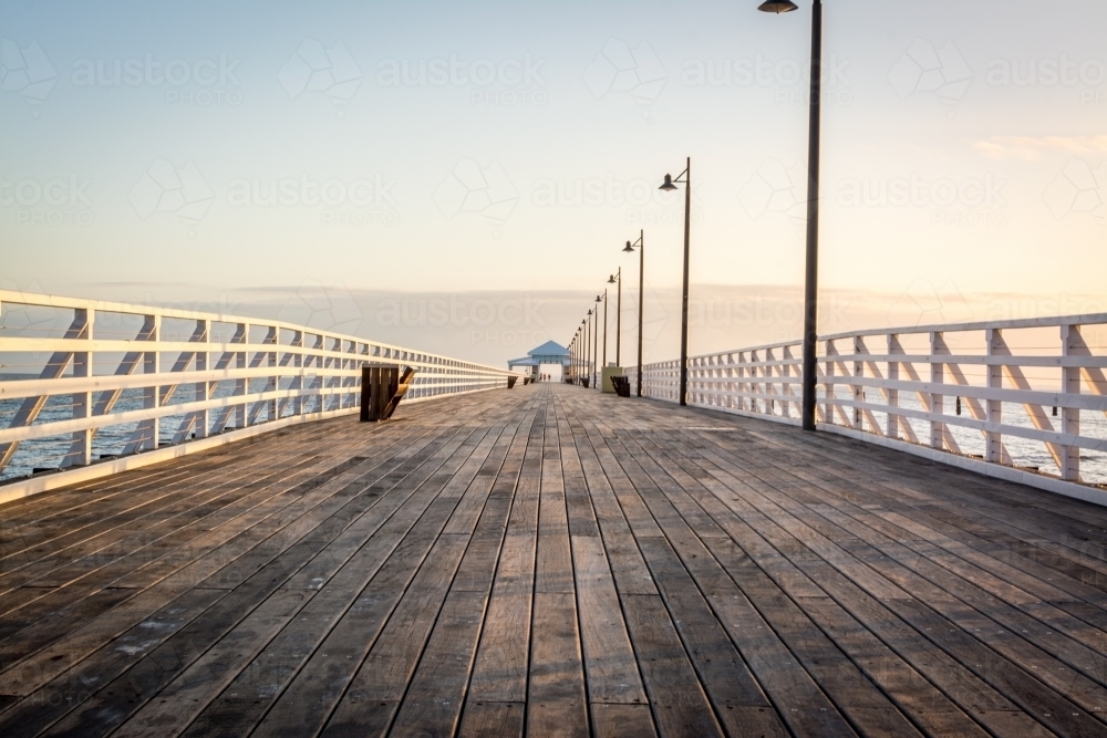 Sunrise along the pier - Australian Stock Image