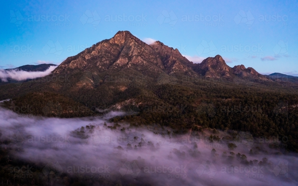 Sunrise fog around Mount Barney, Scenic Rim, Queensland Australia - Australian Stock Image