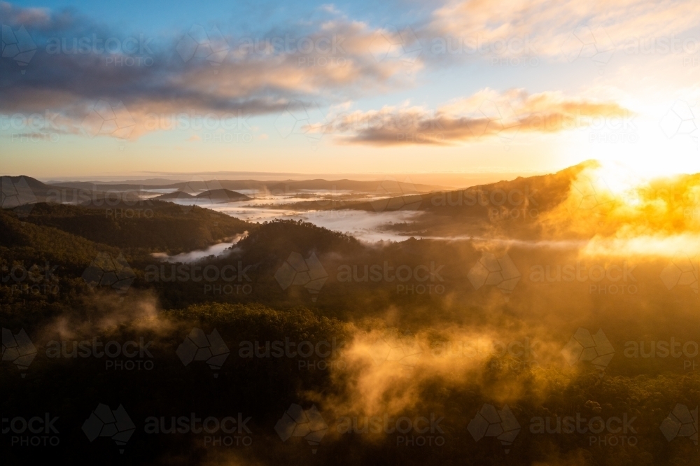 Sunrise fog near Mount Barney, Scenic Rim, Queensland Australia - Australian Stock Image