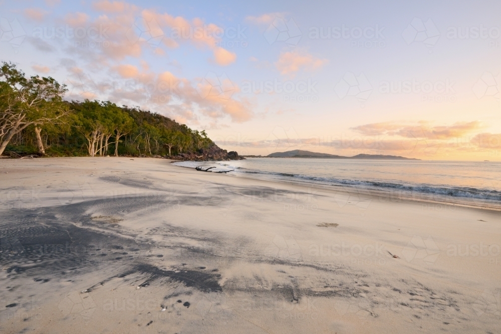Sunrise on Black Sand Beach on Hinchinbrook Island - Australian Stock Image