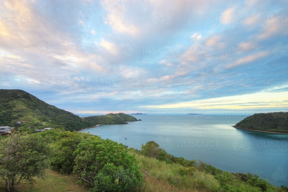 Sunrise over Keswick Island, part of the Whitsundays and Great Barrier Reef Islands - Australian Stock Image