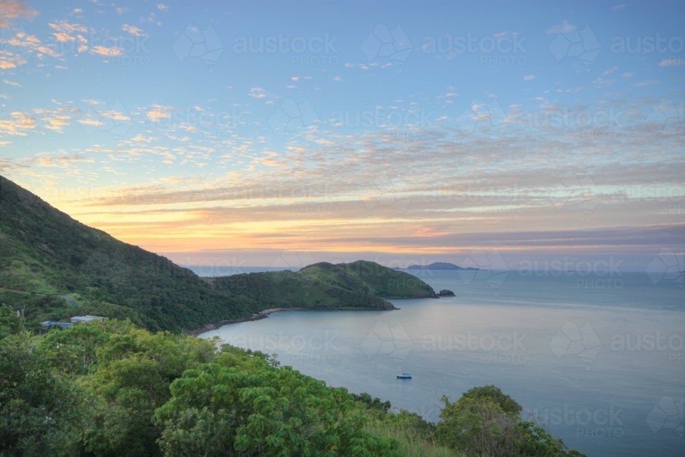 Sunrise over Keswick Island, part of the Whitsundays and Great Barrier Reef Islands - Australian Stock Image