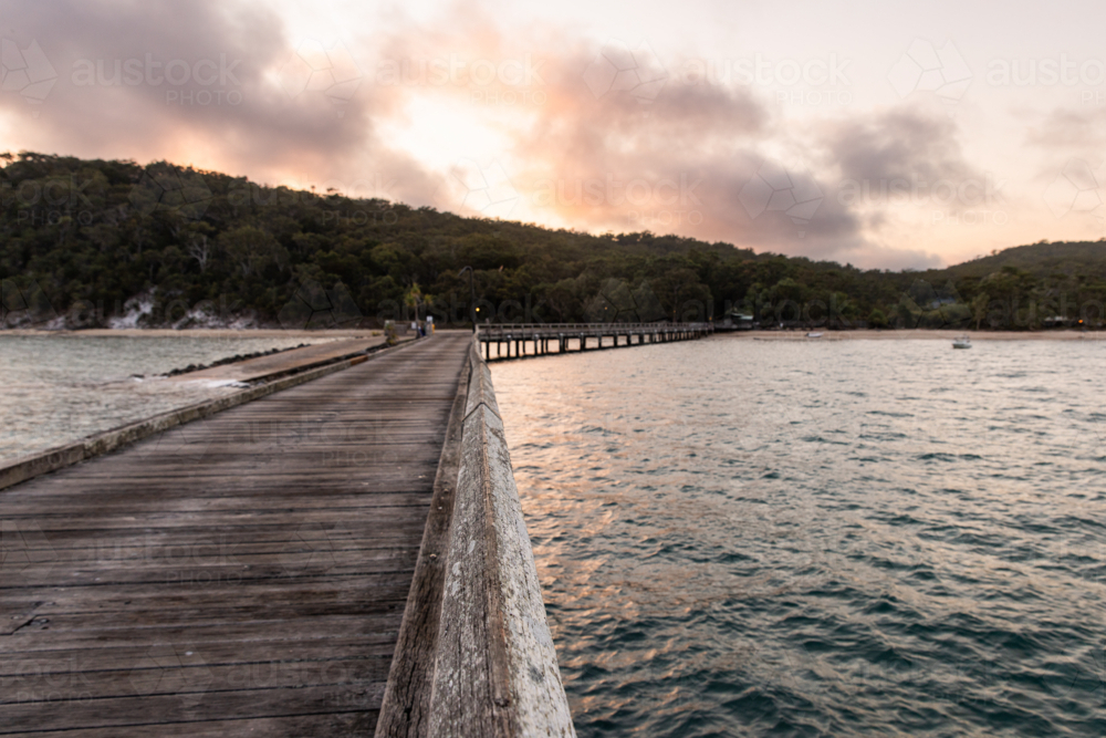 sunrise over the jetty near Kingfisher Bay on K'gari - Australian Stock Image