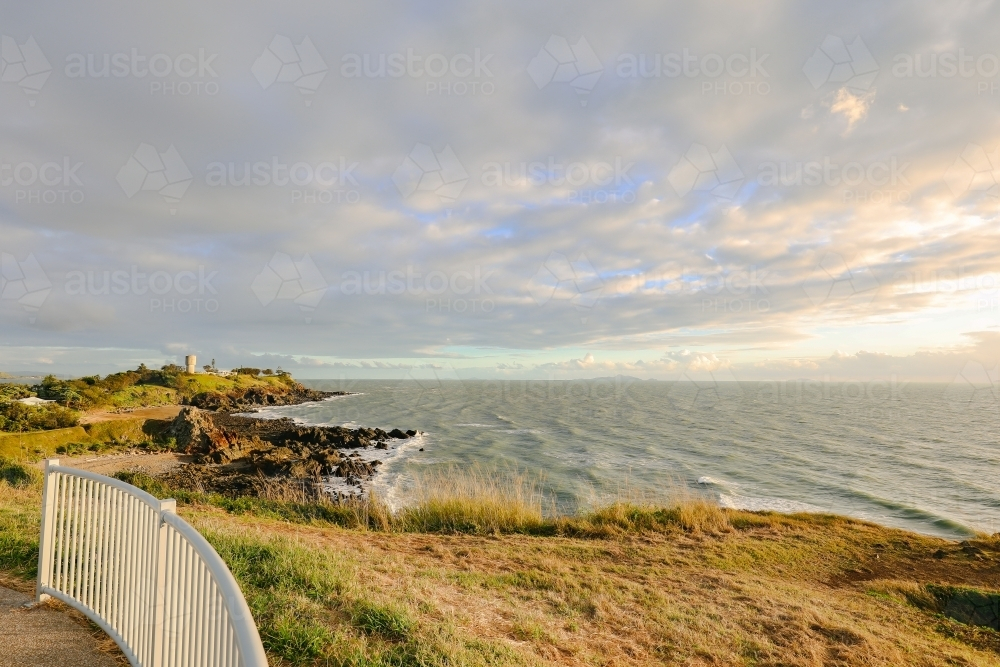 Sunrise over the water from the Lambert's Beach lookout in Mackay - Australian Stock Image