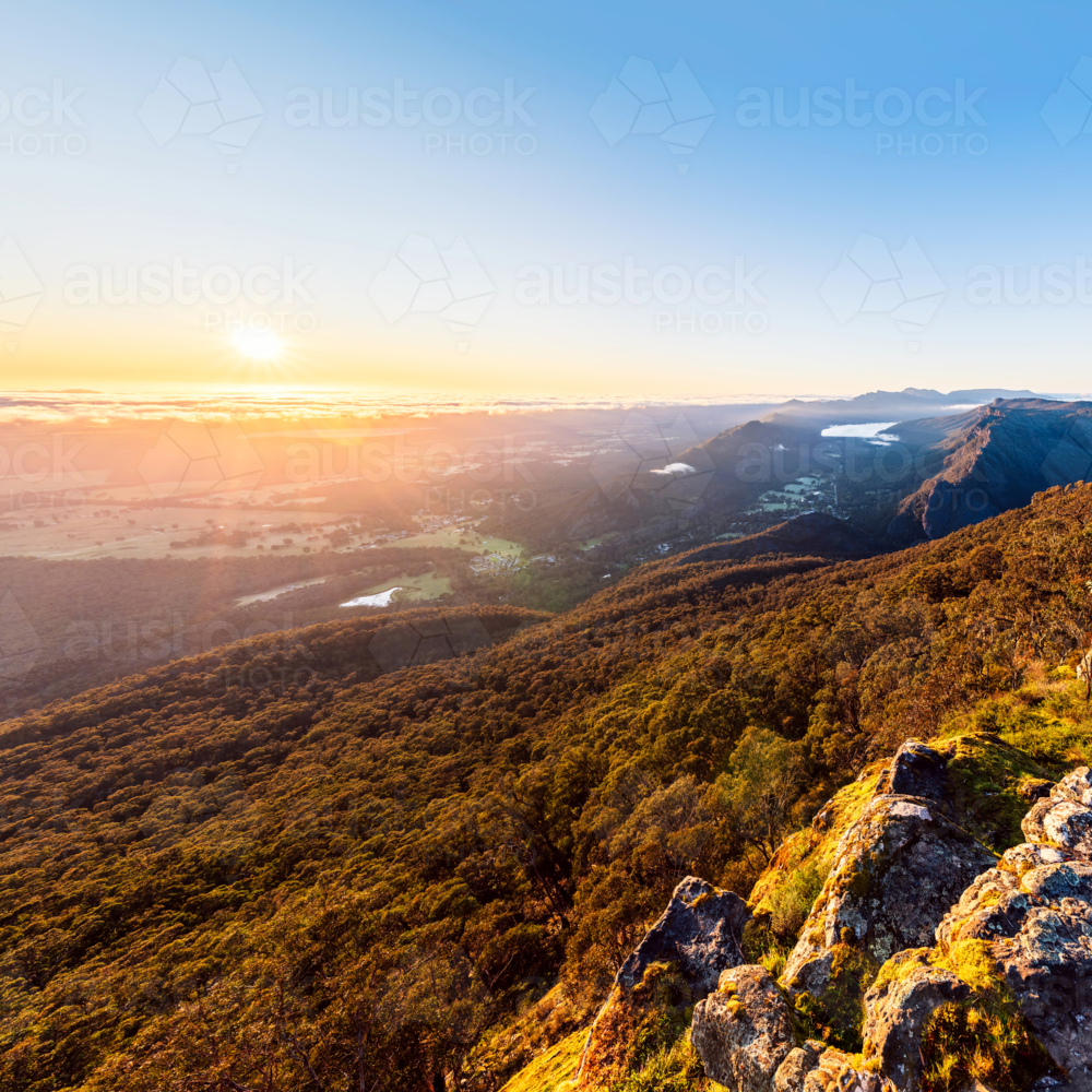 sunrise view above Halls Gap while viewed from Boroka Lookout, Grampians, Victoria - Australian Stock Image