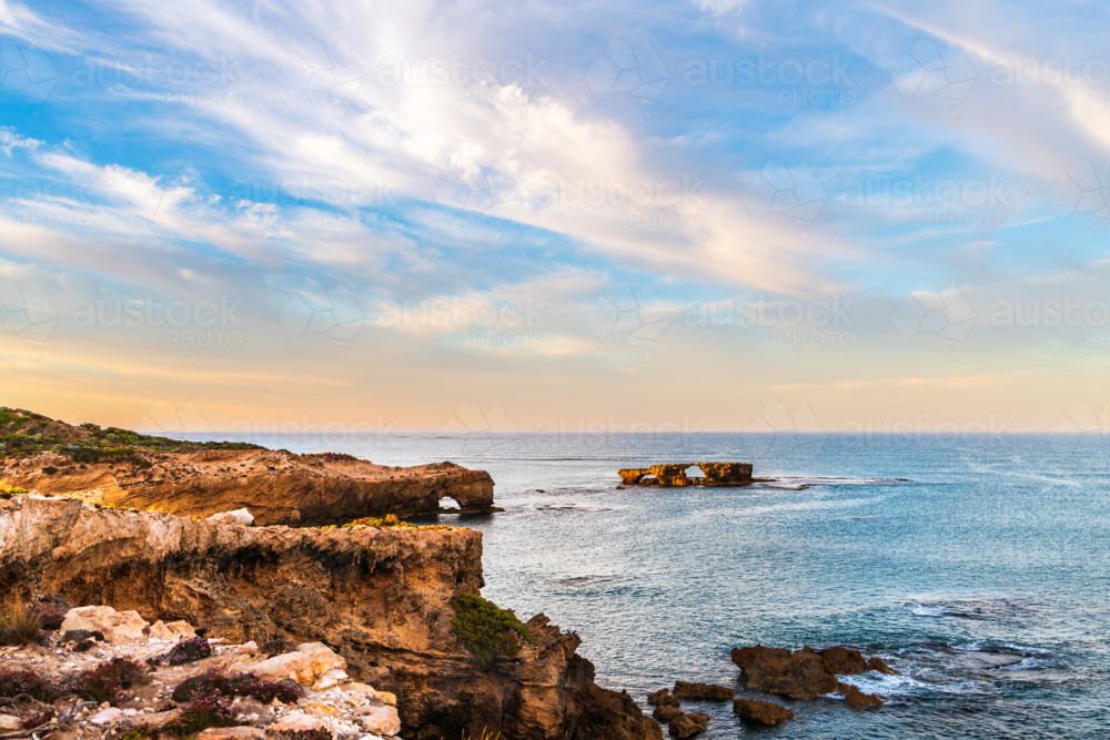sunrise view of the Doorway Rock in Robe, Limestone Coast, South Australia - Australian Stock Image