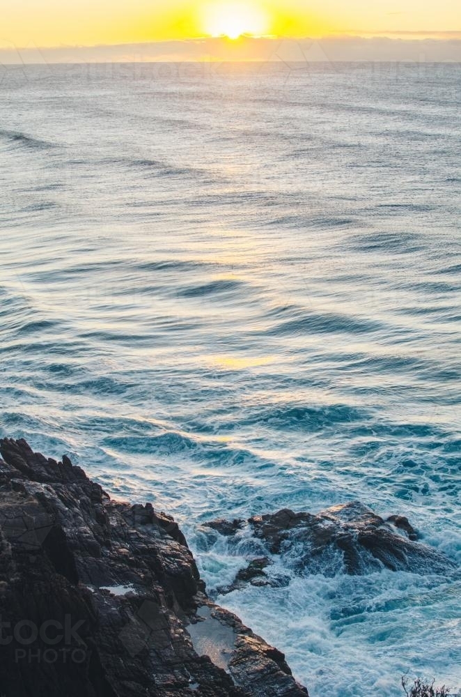 Sunrising over ocean and cliffs - Australian Stock Image