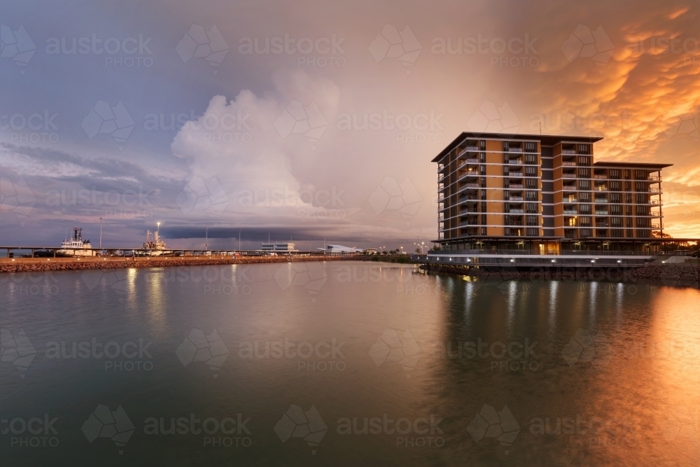 Sunset cloud over Darwin Waterfront apartment building - Australian Stock Image