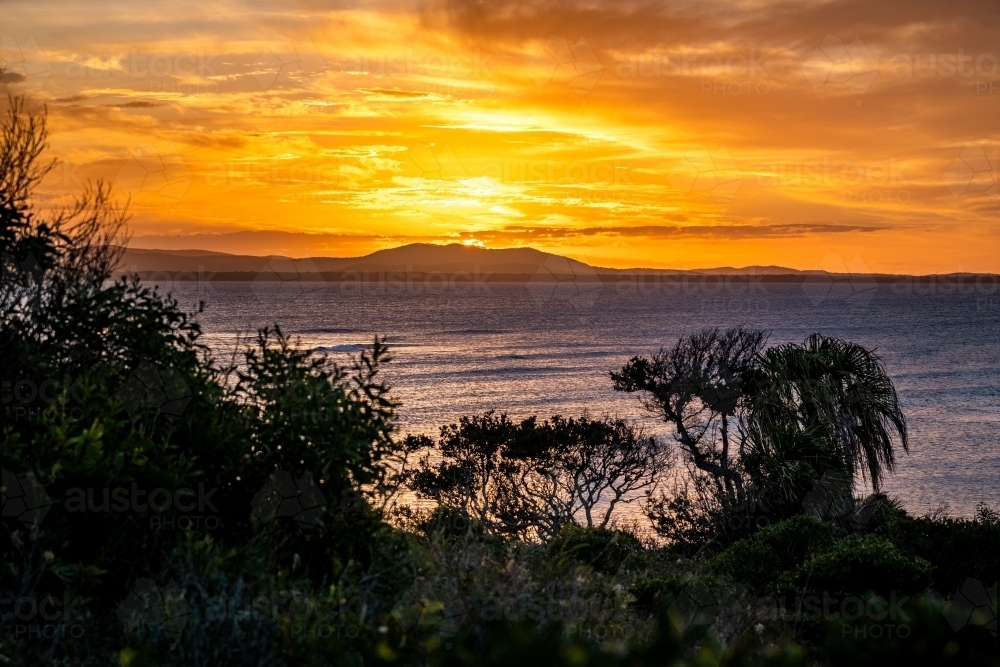 Sunset coastal landscape across Bustard Bay - Australian Stock Image