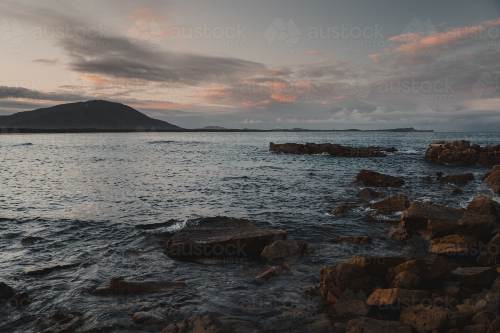 Sunset landscape of the rocky coast at Diamond Head Beach, NSW. - Australian Stock Image