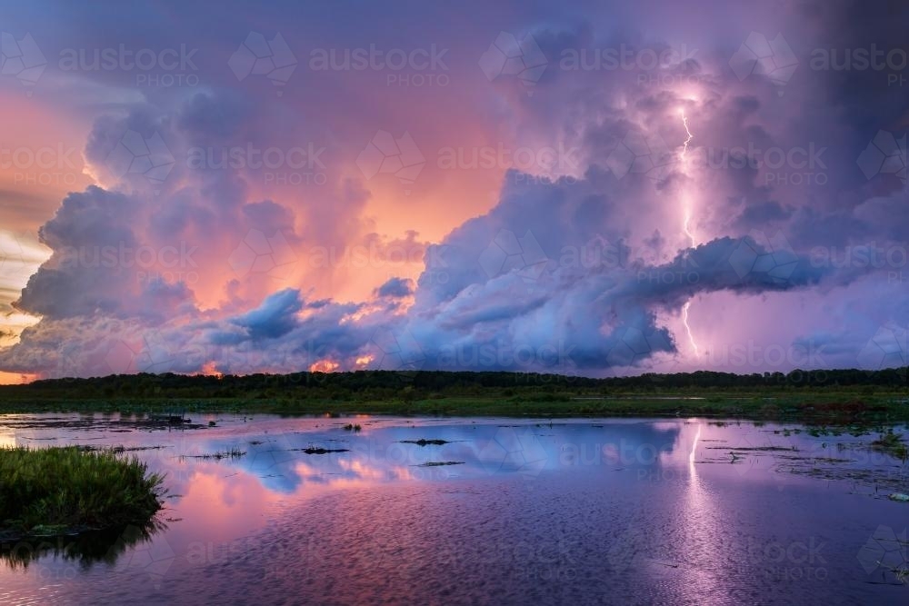 Sunset lightning over Top End wetlands - Australian Stock Image