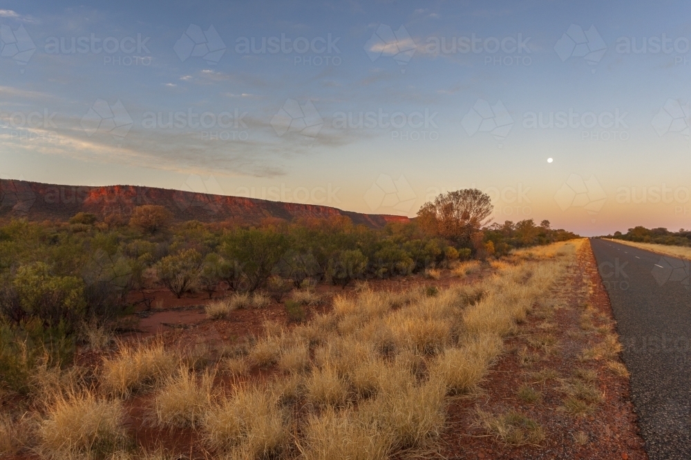 Sunset on a roadside in arid Australia - Australian Stock Image