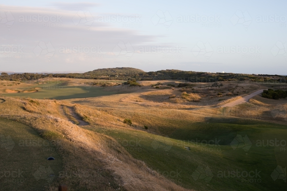 Sunset on golf course next to beach - Australian Stock Image