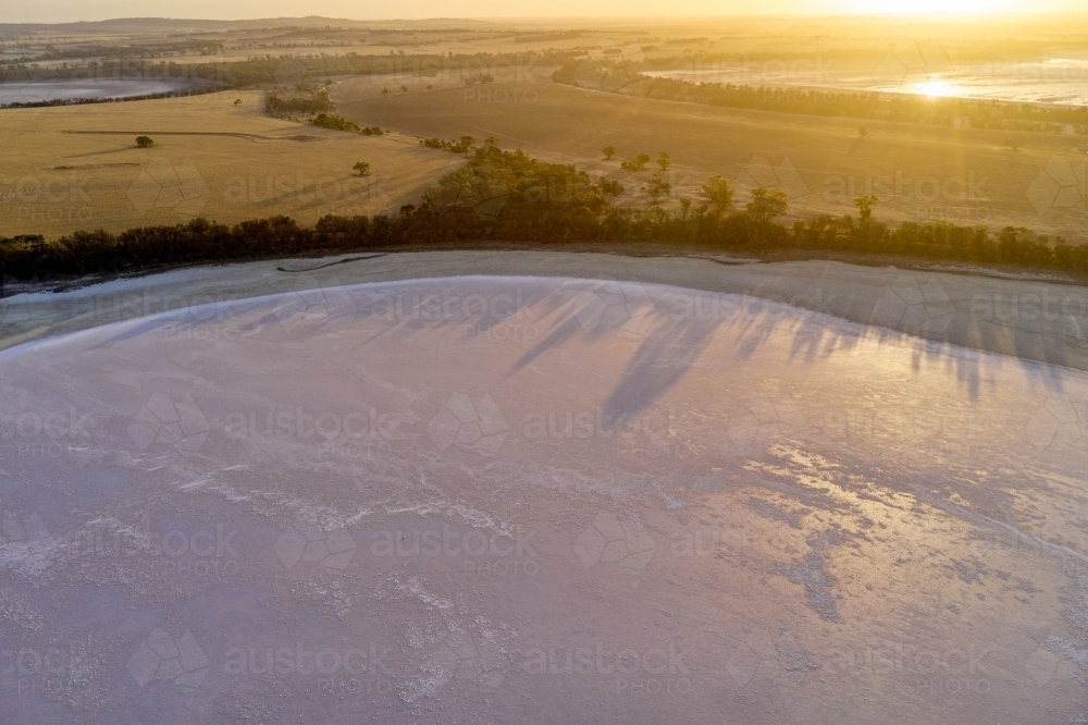 Sunset over a dry salt lake. Lake Flagstaff near Woodanilling in rural Western Australia. - Australian Stock Image