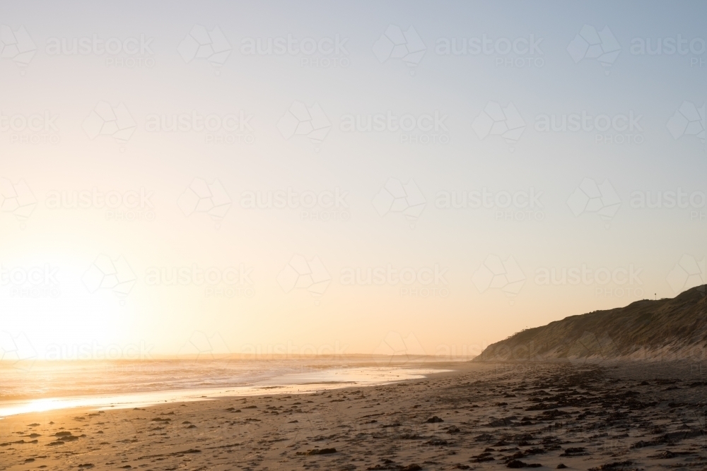 Sunset over beach with large sky - Australian Stock Image