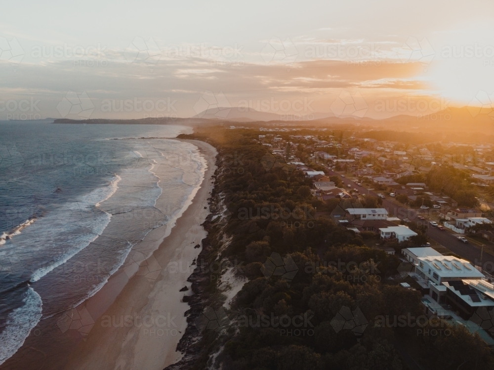 Sunset over the beachfront properties at Lake Cathie - Australian Stock Image