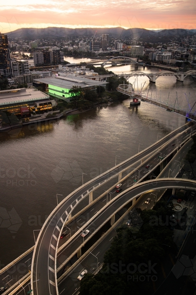 Sunset over the Brisbane River looking towards Mt Coot-tha at dusk - Australian Stock Image