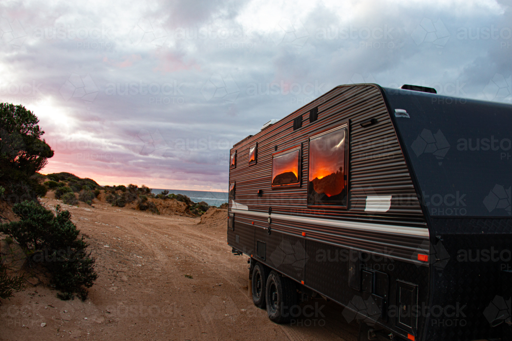 Sunset reflecting into caravan windows - Australian Stock Image
