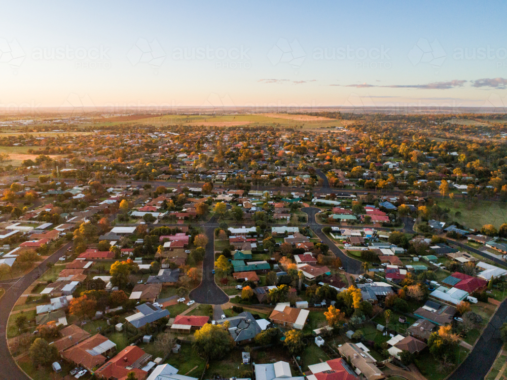 Sunset townscape of Dubbo in inland Australia with flat land to horizon - Australian Stock Image