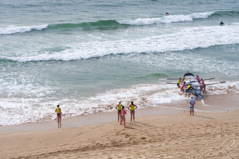 Surf boat teams on the beach - Australian Stock Image
