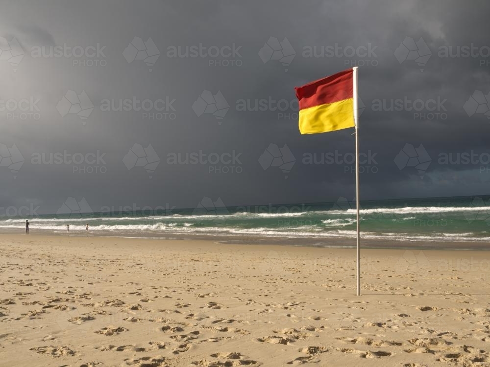 Surf lifesaving flag on a beach - Australian Stock Image