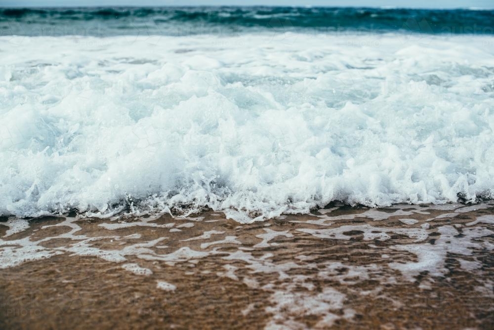 Surf rolling in - Australian Stock Image