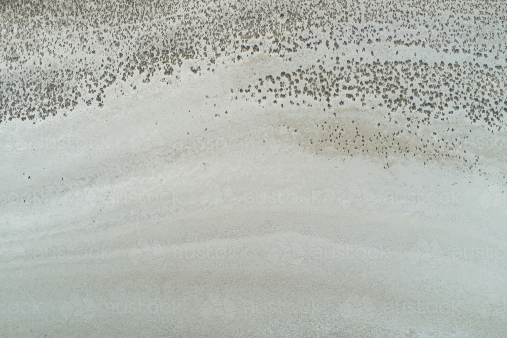 Surface texture and patterns of a dry salt lake - Australian Stock Image