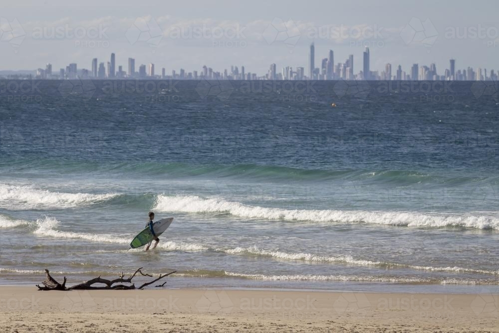 Surfer at Rainbow Bay - Australian Stock Image
