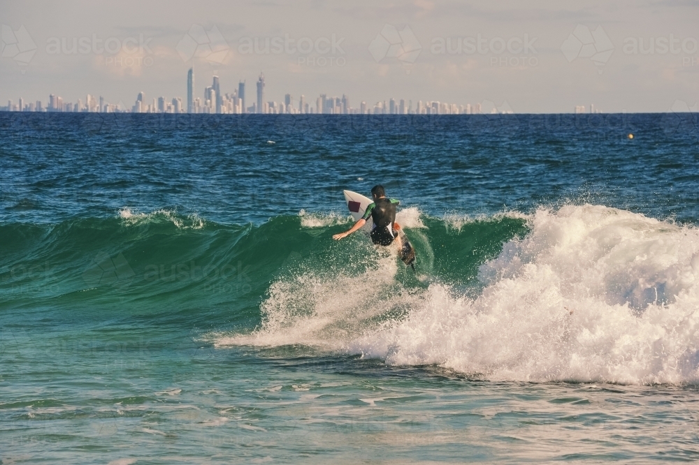 Surfer carving on a wave - Australian Stock Image