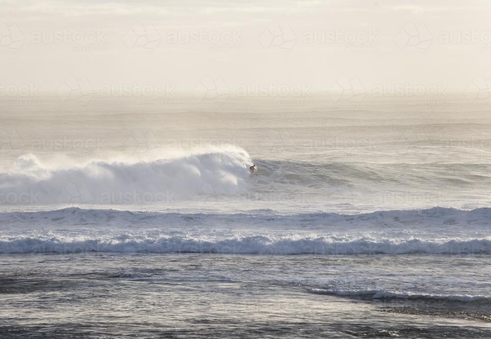 surfer riding a big wave - Australian Stock Image