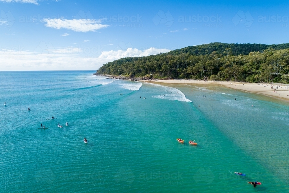 Surfers and waves at Noosa. - Australian Stock Image
