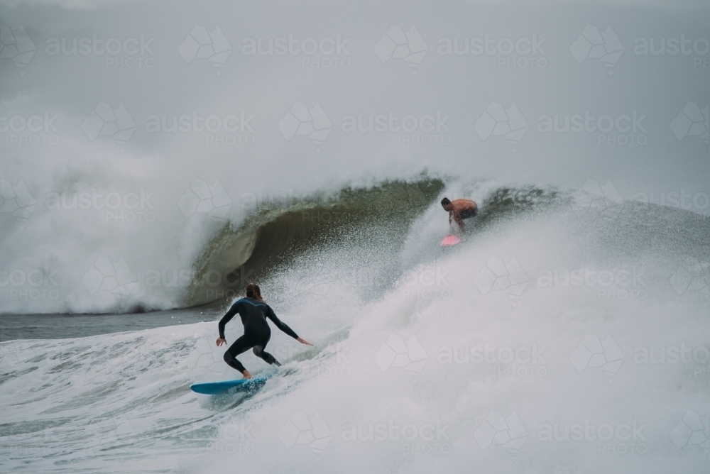 Surfers catching some waves - Australian Stock Image
