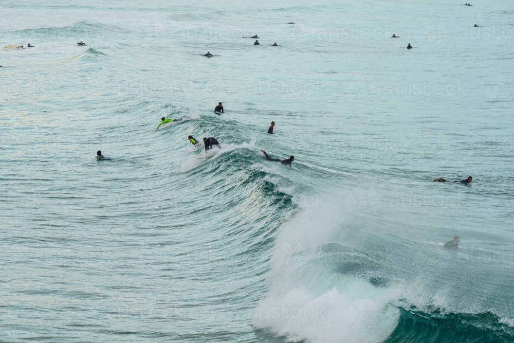 Surfers in the water waiting for a big wave - Australian Stock Image