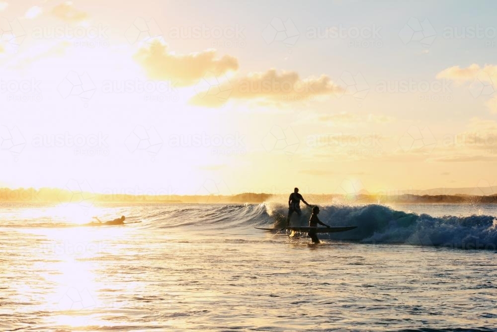 Surfing at sunset - Australian Stock Image